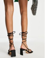 Ronnie arrow toe tip up sandal in black