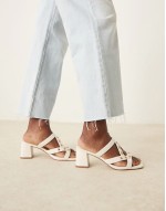 Howdy stud detail caged mid heeled mules in off white